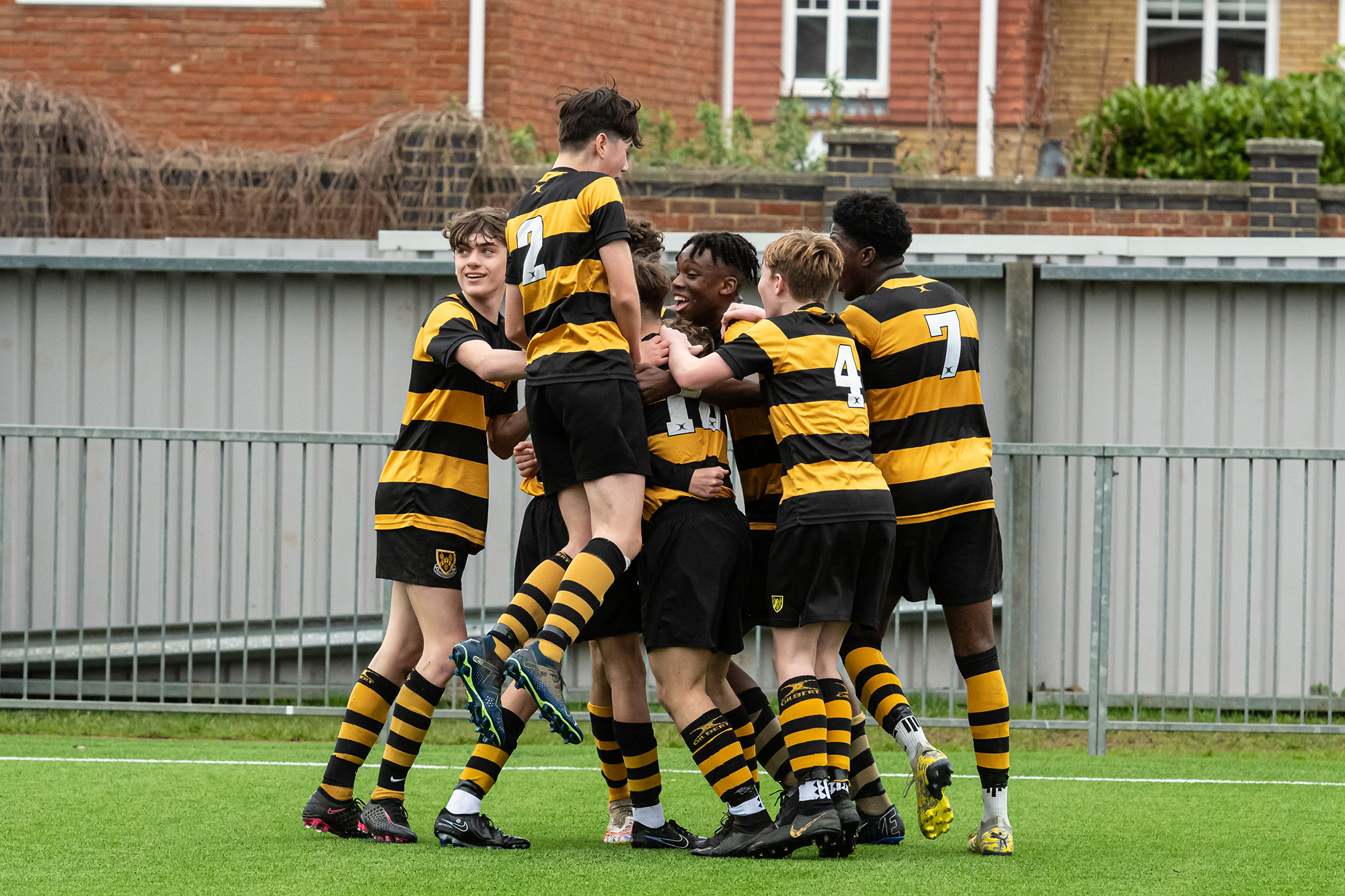 U15 footballers celebrating a goal during the ISFA Shield Final against Dunottar School