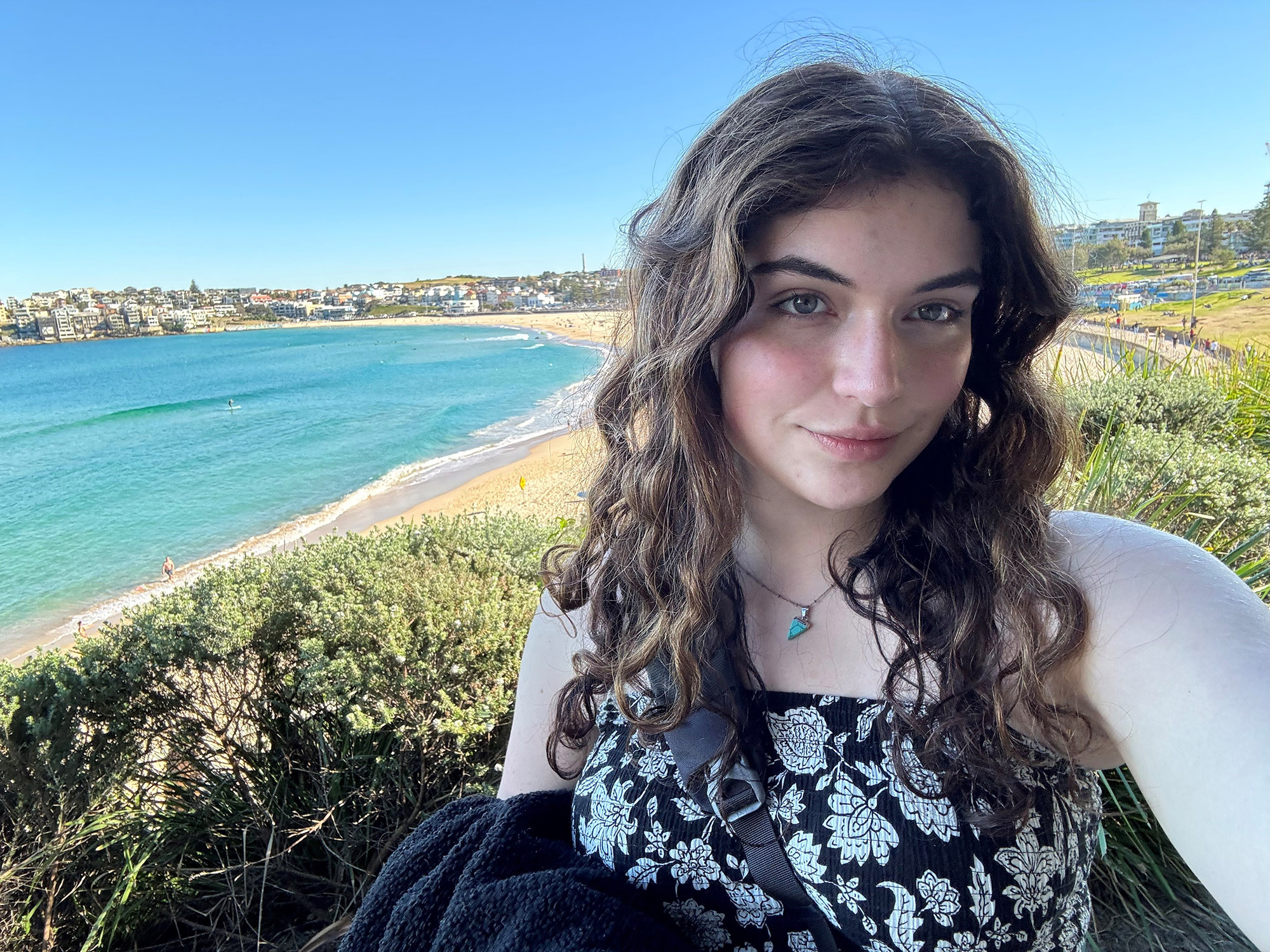 Alex Hartemink, the winner of the Albert Johnston Travel Award, posing for a photo by the sea