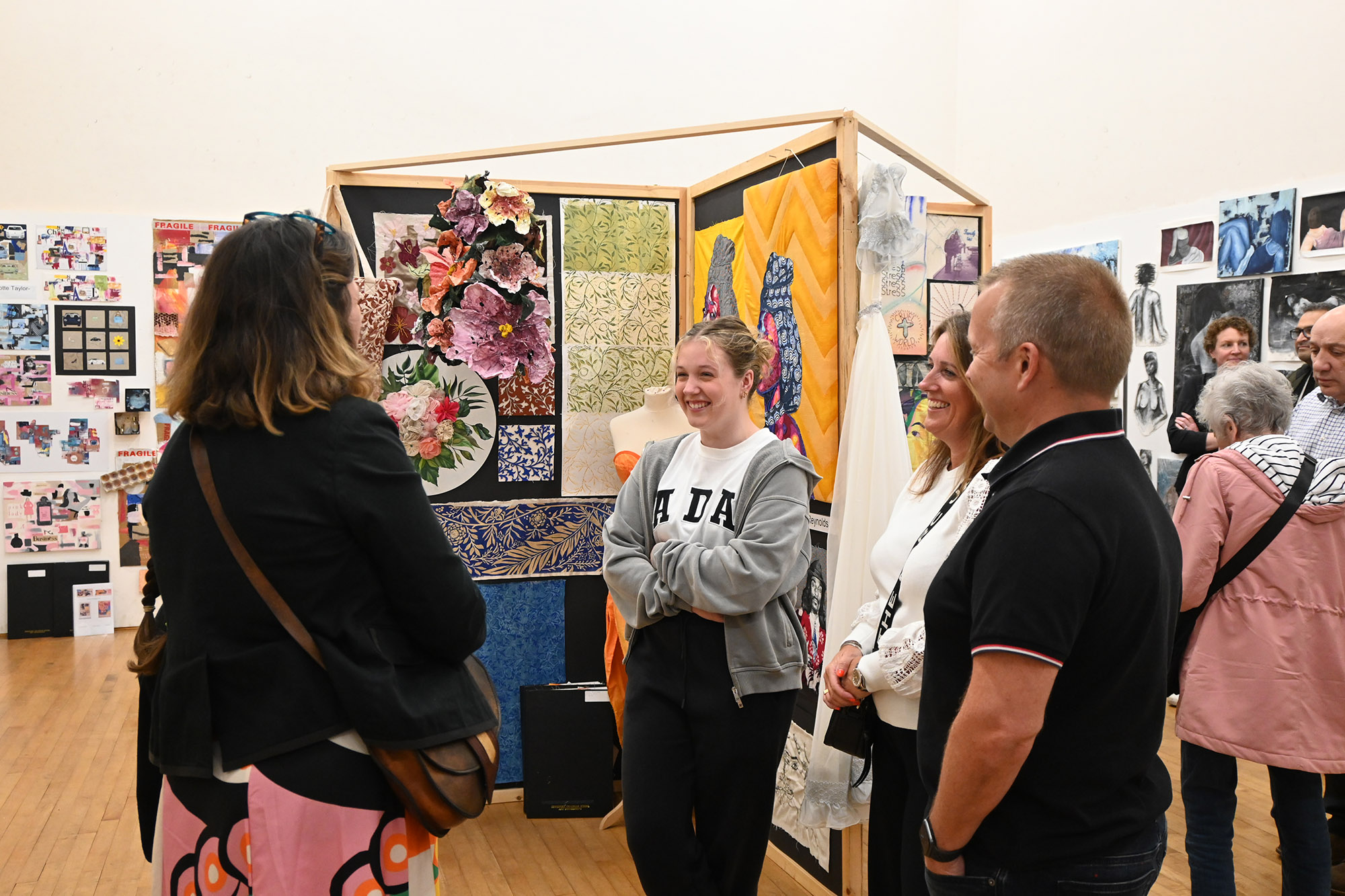 Visitors and artists at the 2024 A Level and GCSE Art Exhibition