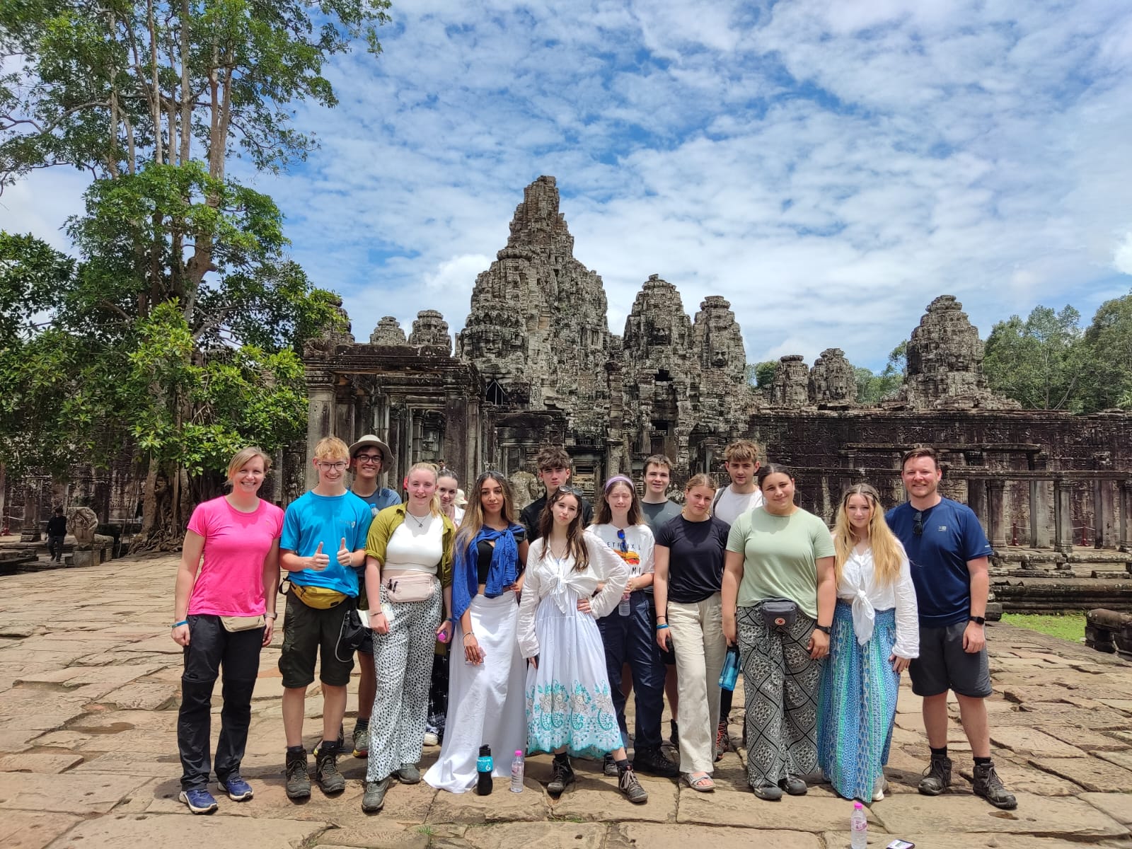 Lower Sixth students and staff on the expedition to Cambodia and Vietnam pose for a photo in front of a landmark