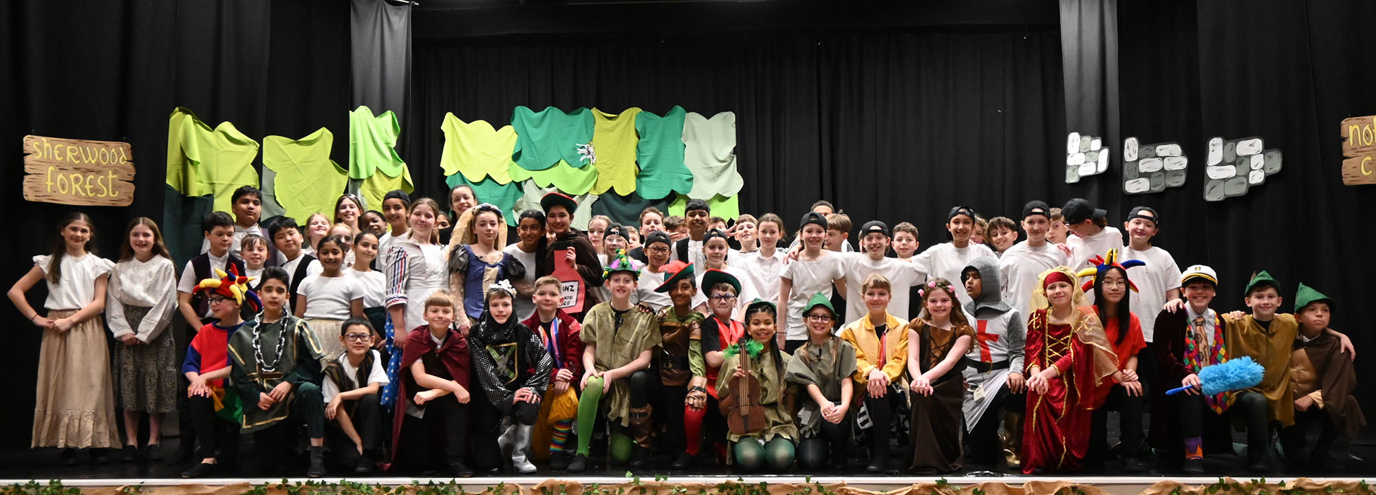 Junior School pupils pose for a photo during the performance of Robin And The Sherwood Hoodies