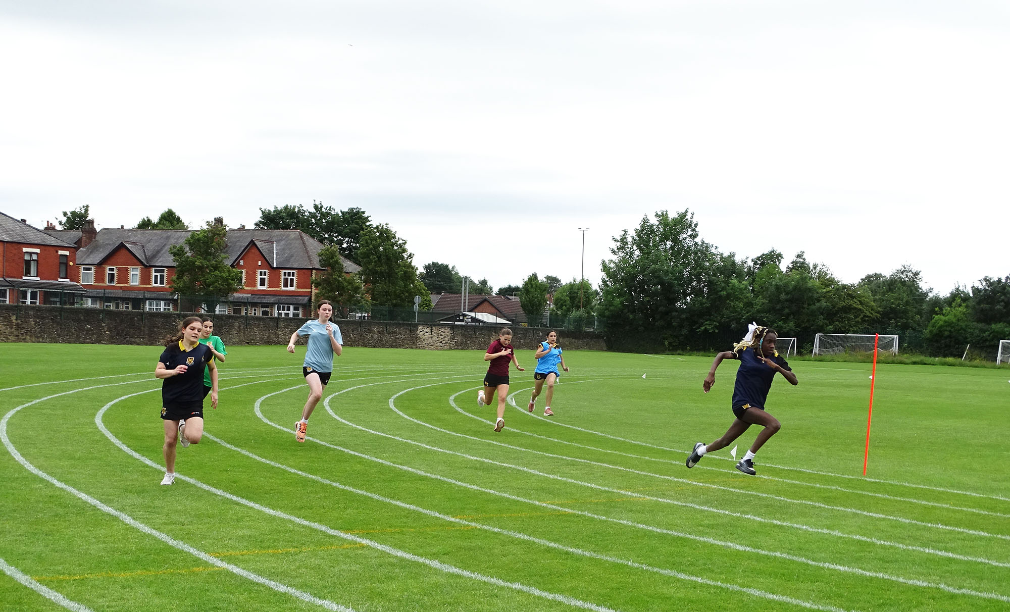 Girls taking part in a race during Sports Day 2025
