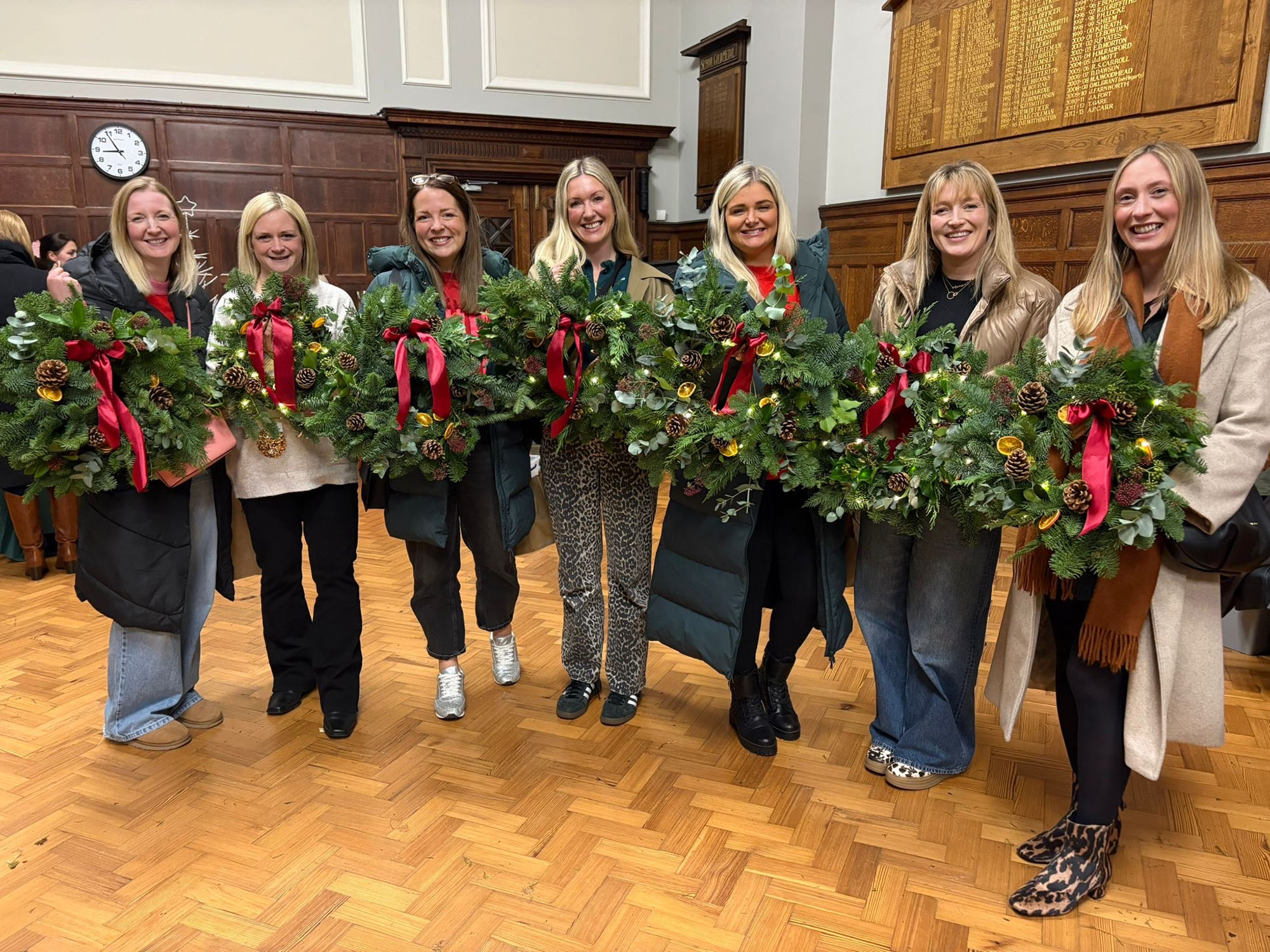 Attendees at the SPA's Christmas wreath making event with their finished products