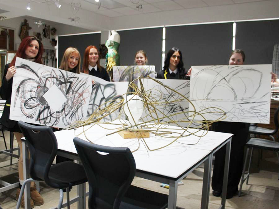 Fifth Years displaying some of the work they created during a taster A Level Art and Design lesson