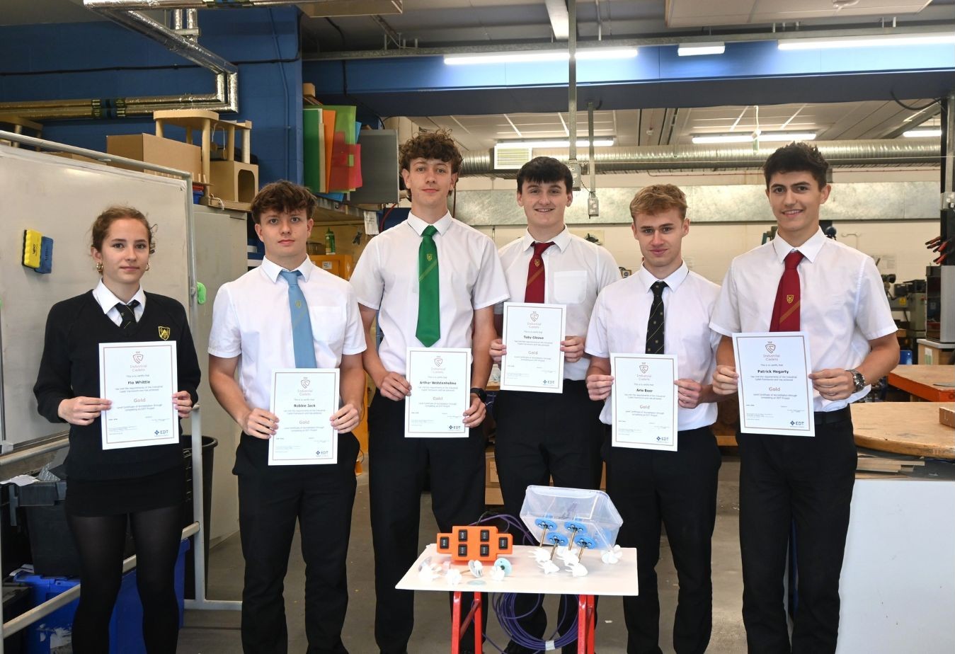 Six Lower Sixth pupils with their Industrial Cadets certificates