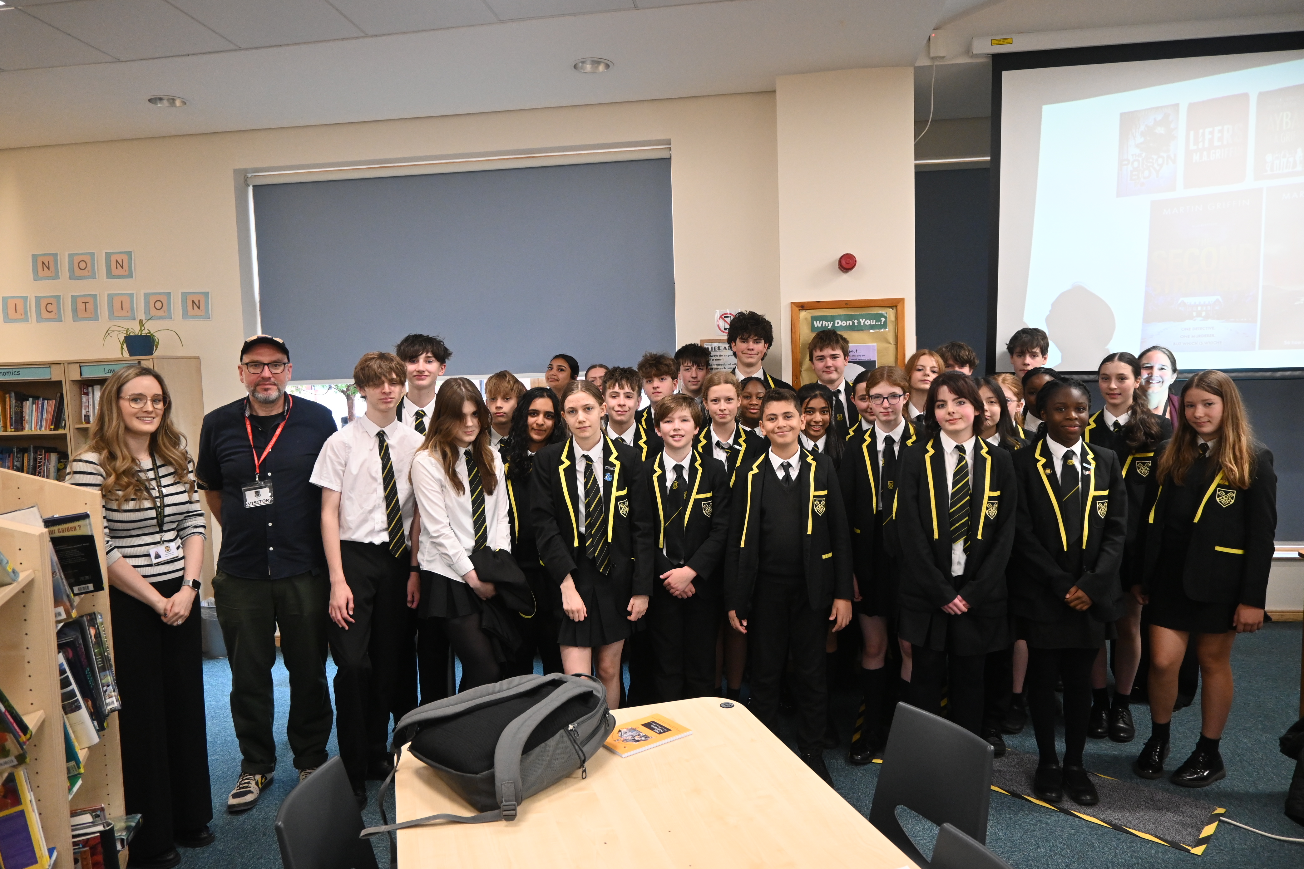 Lower School pupils pose for a photo with writer Martin Griffin