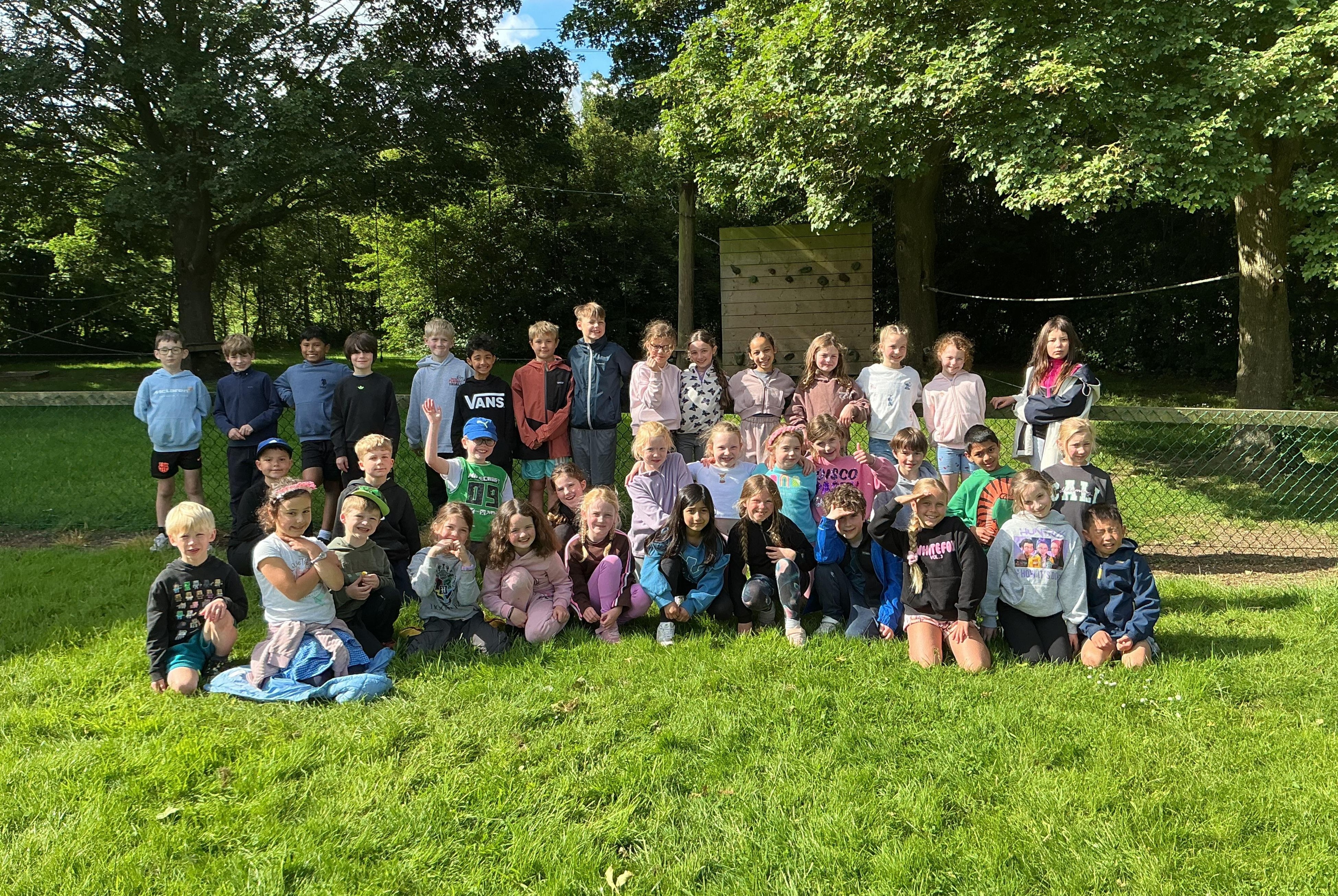 Year 3 pupils pose for a photo outside during their 2026 residential